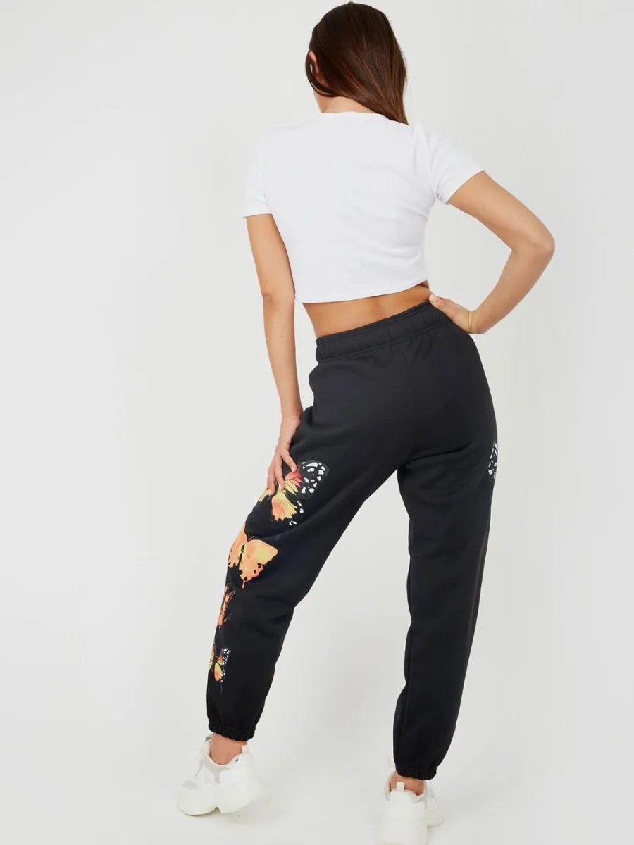 Machela Butterfly Graphic Oversized Fleece Joggers In Black
