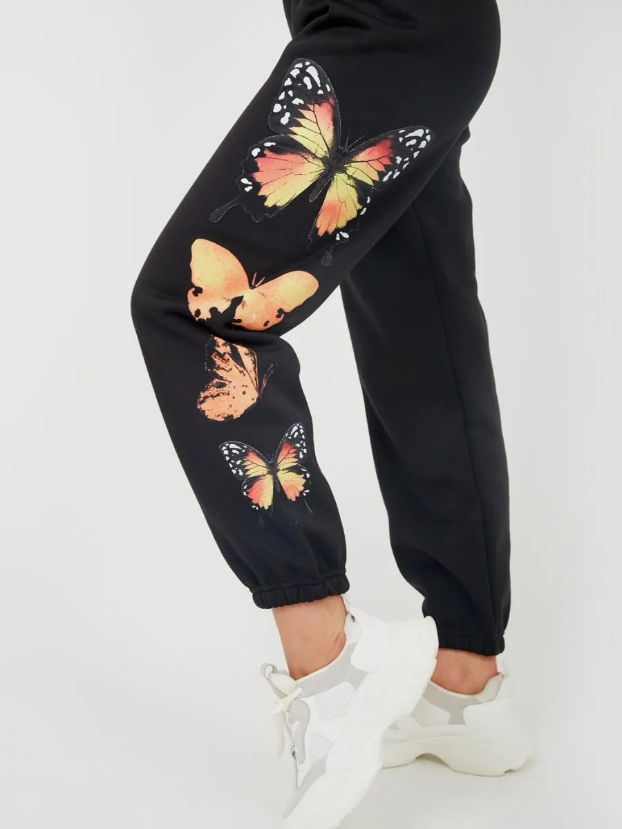 Machela Butterfly Graphic Oversized Fleece Joggers In Black