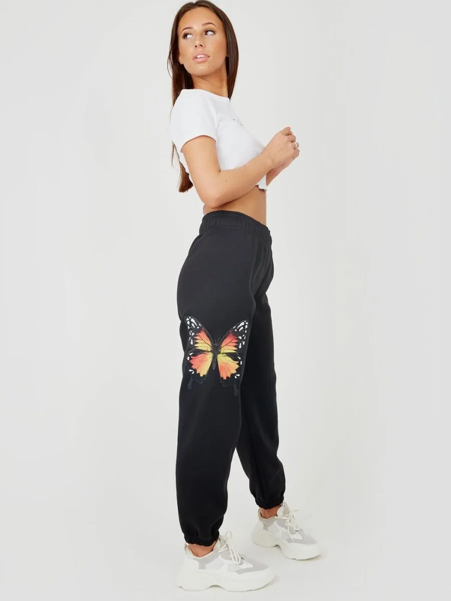 Machela Butterfly Graphic Oversized Fleece Joggers In Black